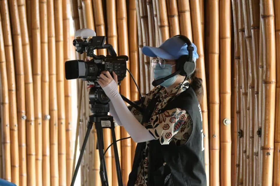 XinChuan Studio member operating a camera at the Southeast Asian Culture Festival