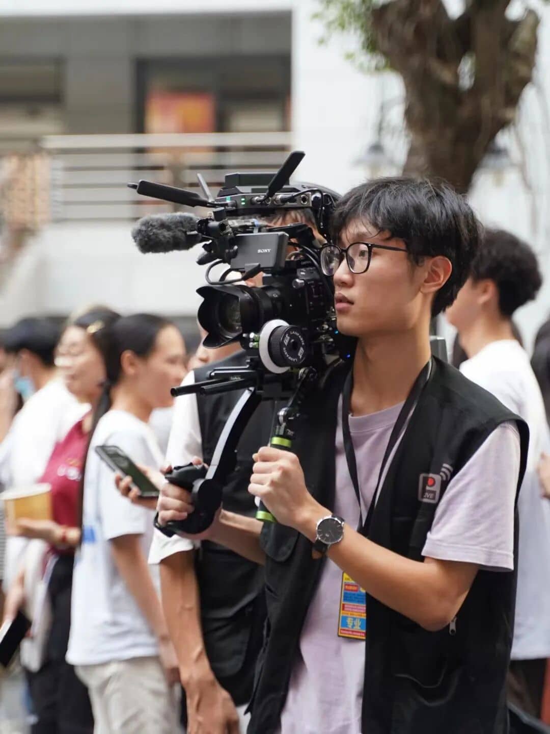 A XinChuan Studio member filming at the World Culture Festival