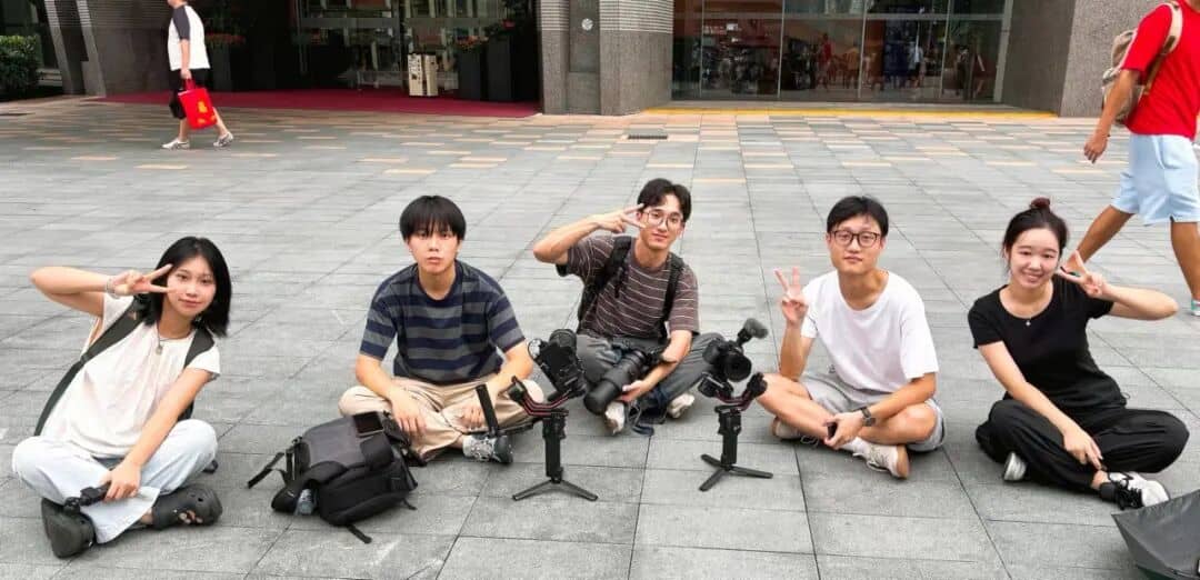 Keyframe Party members filming on location with camera stabilizers